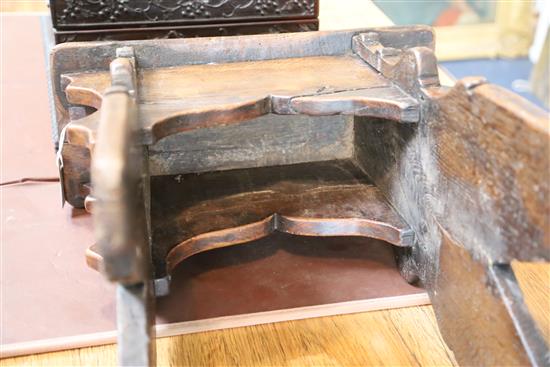 An early 17th century boarded oak stool, 1ft 7.5in. x 8.5in. H.1ft 10.5in.